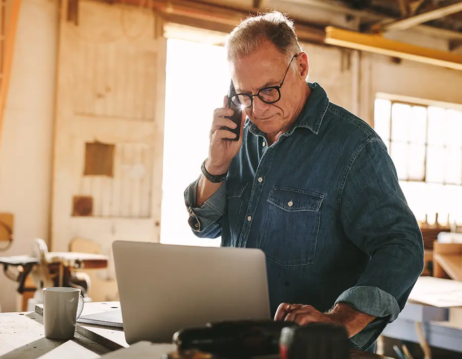 woodworker looking at laptop