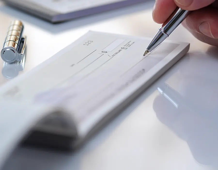 person writing check