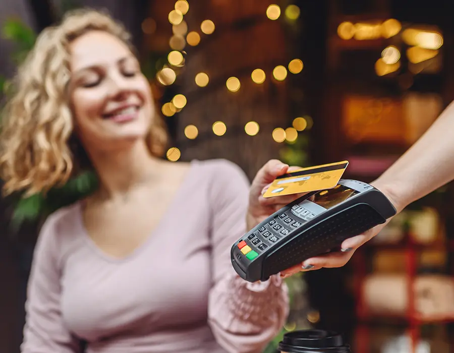 woman paying with credit card